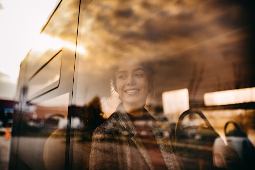 Young beautiful woman riding in public bus